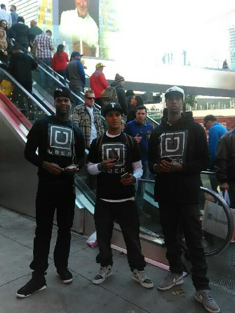 Team Rideshare USA street team in branded Uber shirts on the Las Vegas Strip