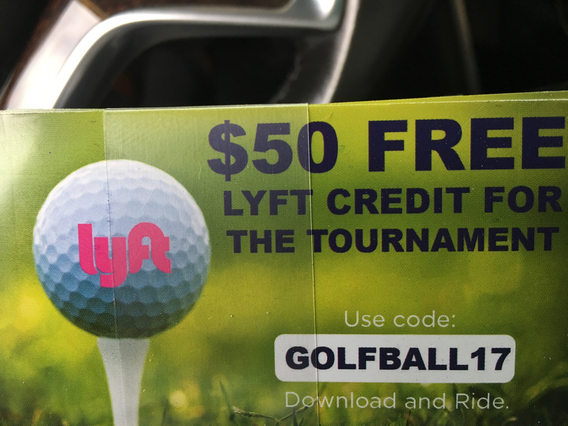 Printed Lyft golf tournament card offering $50 free credit with code GOLFBALL17