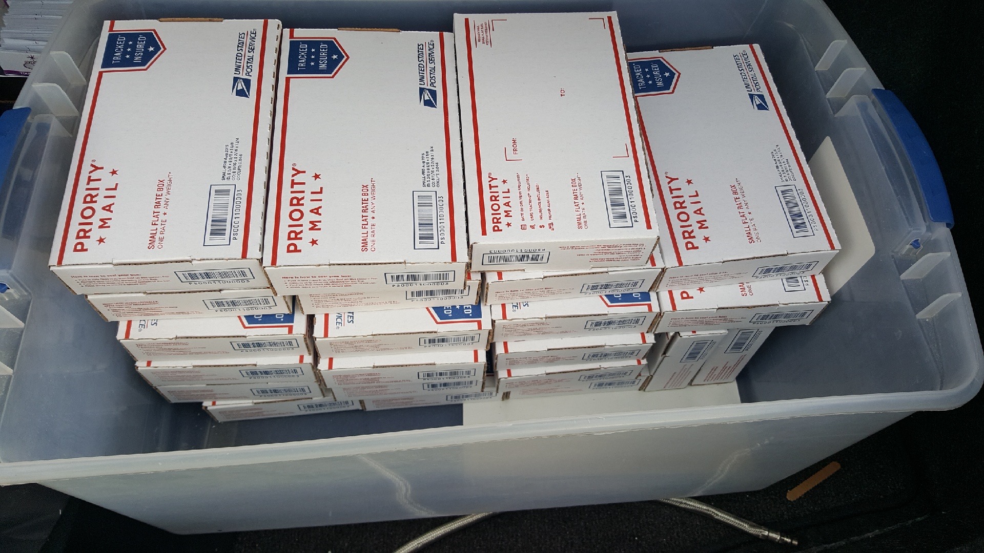 Flat-rate pilot mailers packed with display boxes, ready to ship to hotels and venues