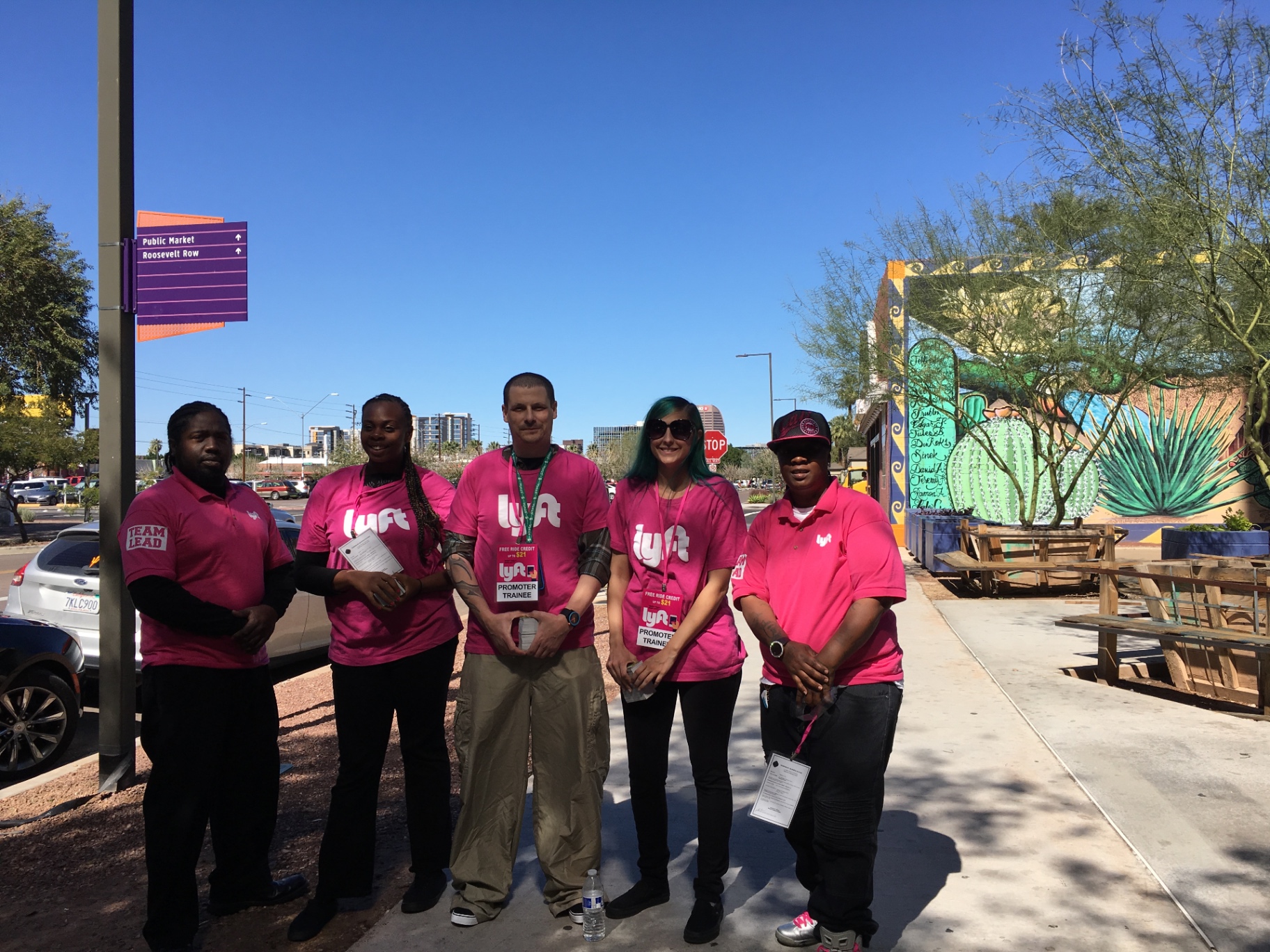 Five-person Lyft street team in pink shirts at a Roosevelt Row activation