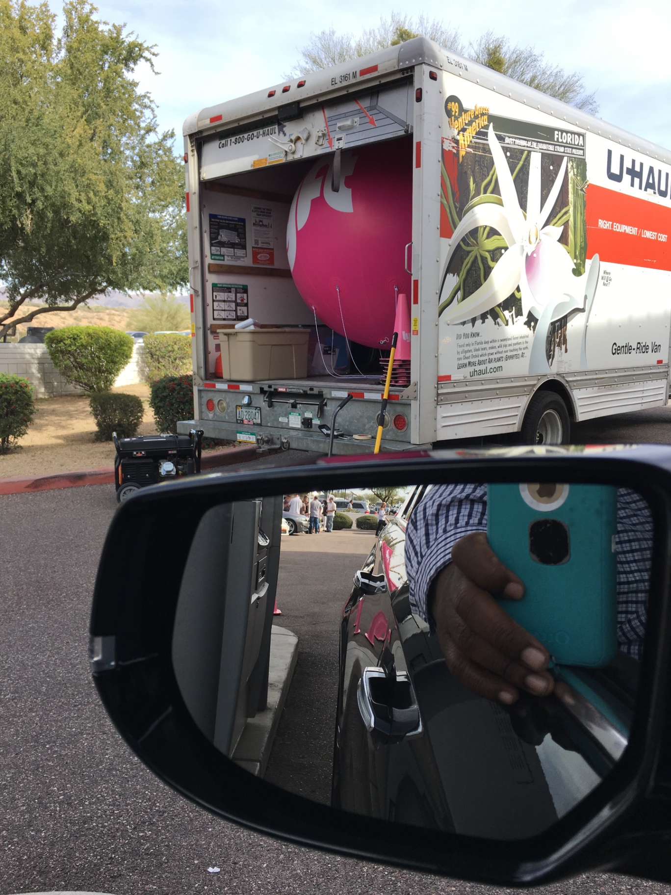 Giant pink Lyft mustache being transported for a mobile event activation