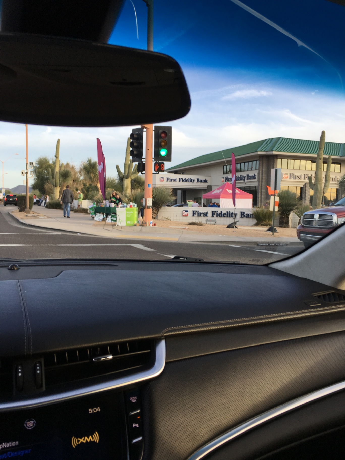 Lyft branded tent and feather flags on a busy street corner